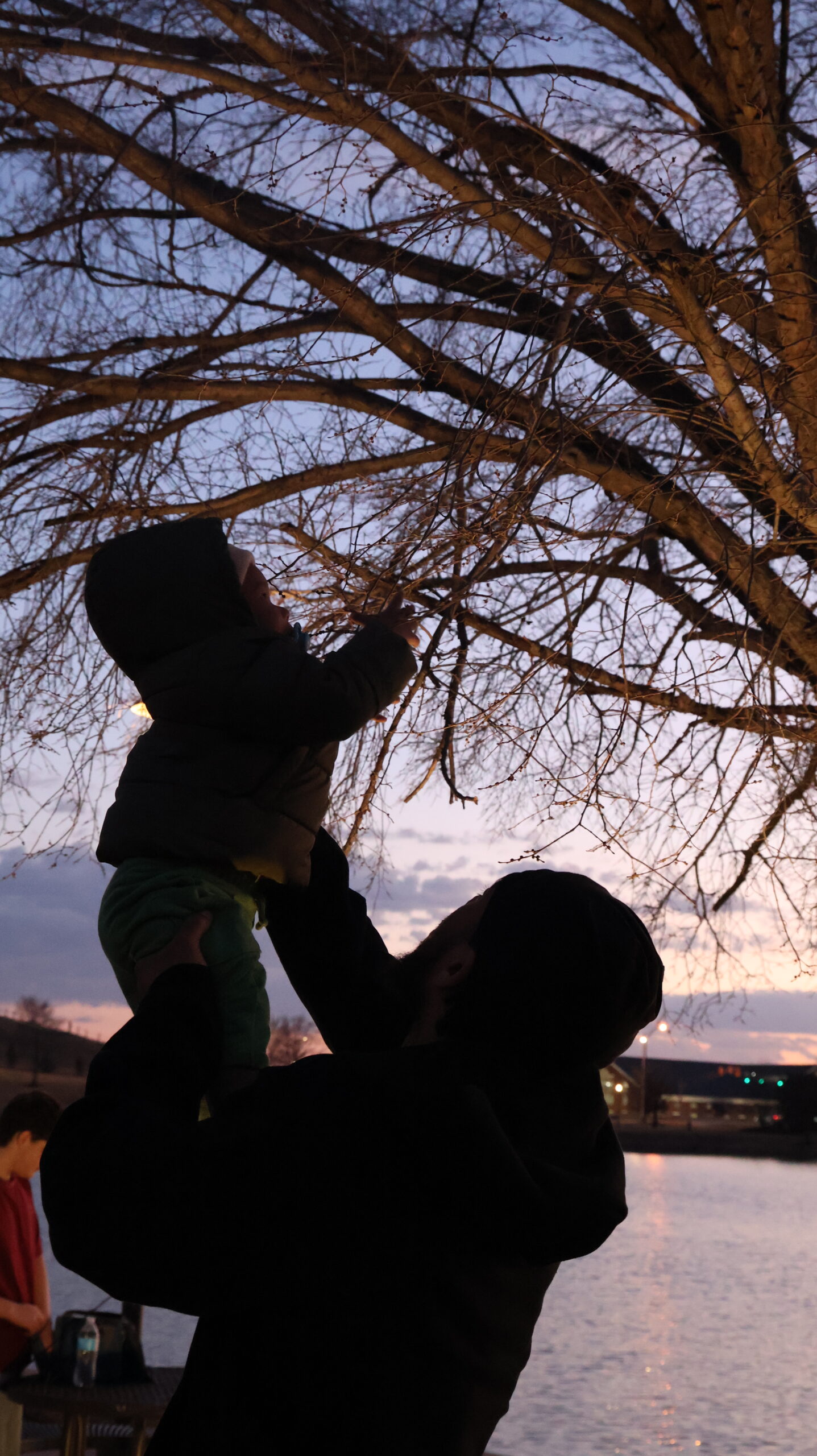 Family lifestyle portrait by the water photographed by LAL ST